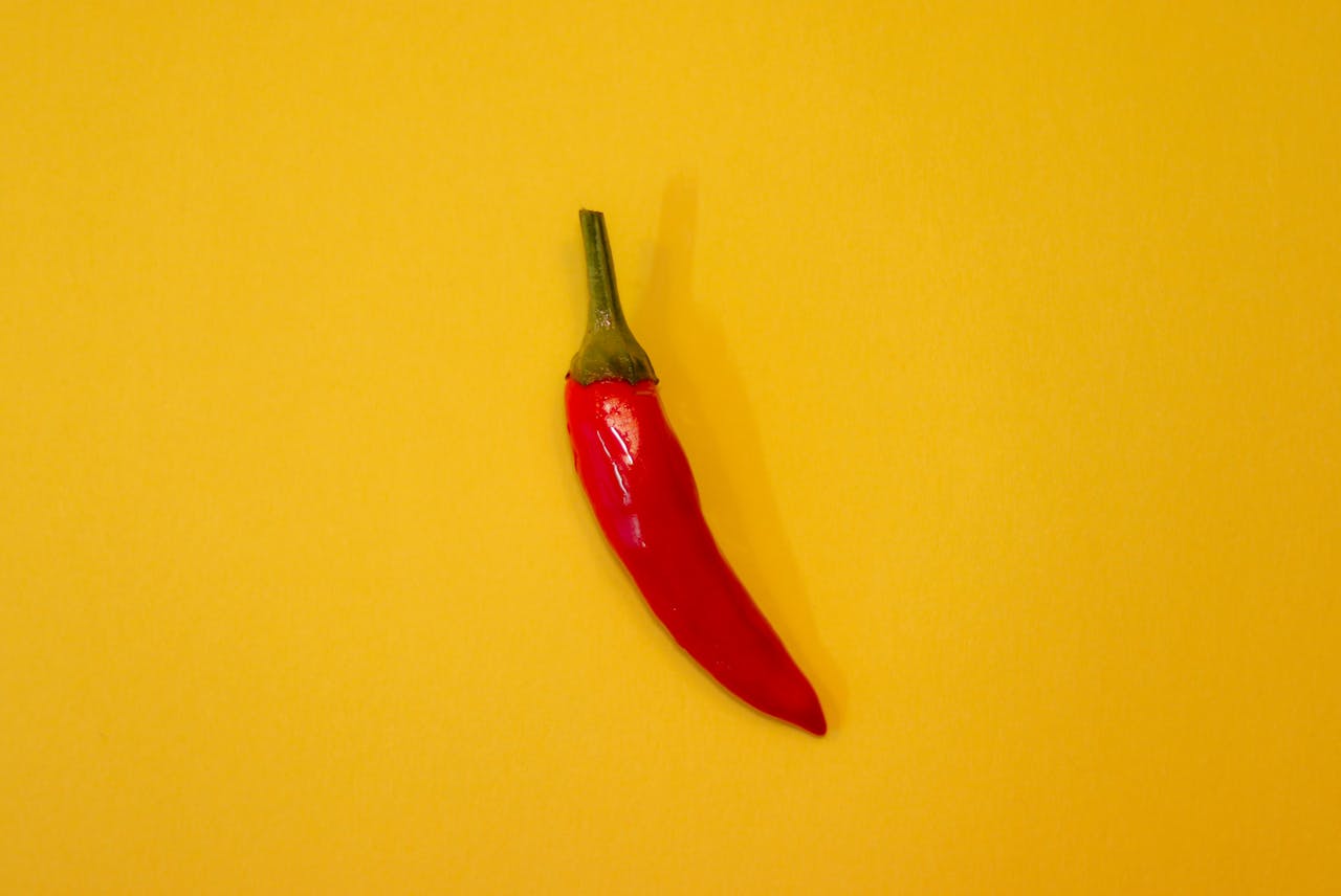 Red Chili on Yellow Surface